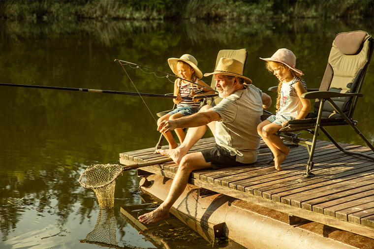 grandfather fishing with his grandkids at the end of a dock reaosnable rate of return during retirement okeechobee fl