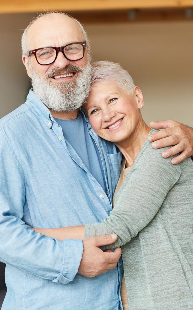 portrait of smiling senior couple with arms around each other types of life insurance okeechobee fl